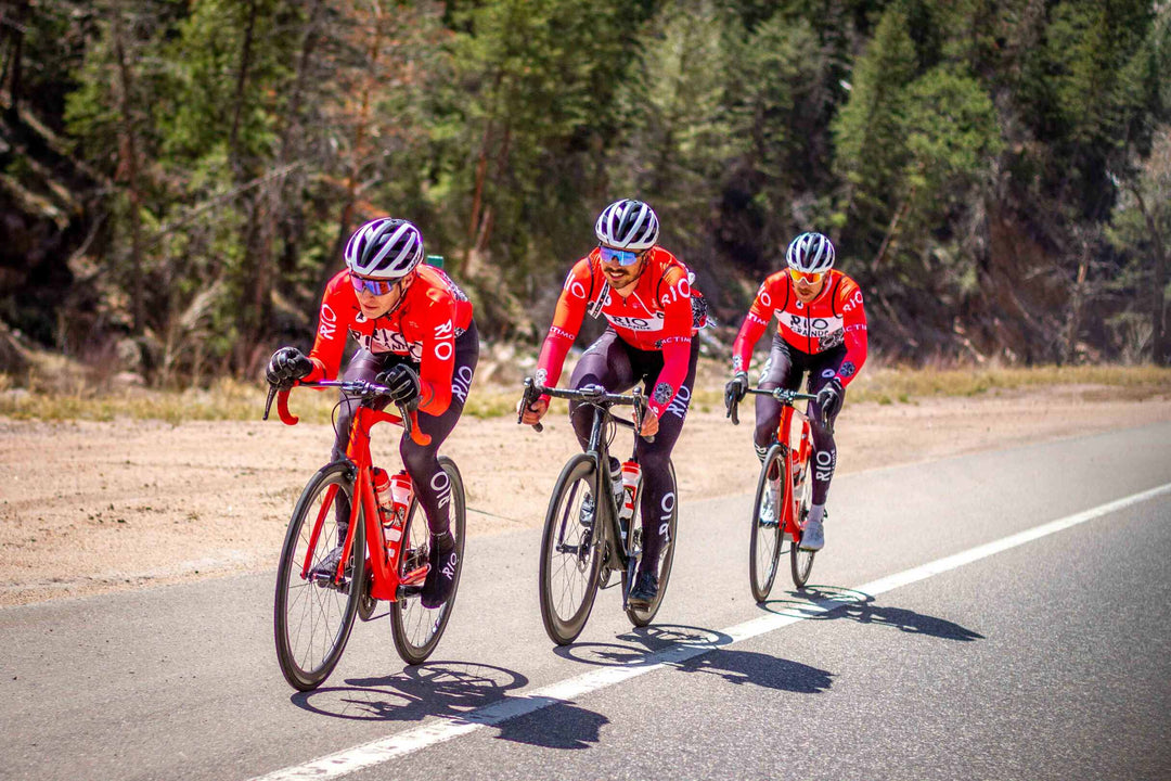 Three riders in Pactimo custom kit on a mountain road